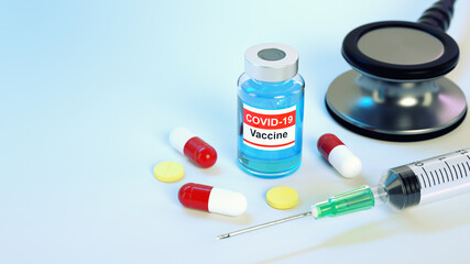 Vaccine bottle, pills, syringe and stethoscope  with copy space for Covid-19 pandemic concept.  