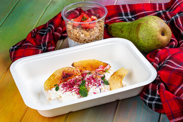 Stewed pear with curd mousse. Diet and healthy food  in eco containers. Takeaway.