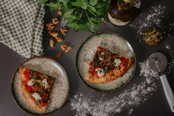 Handmade lamb pizza with pesto sauce.