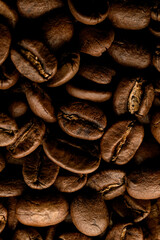 Close-up pattern of dark roasted coffee beans. Can use for background