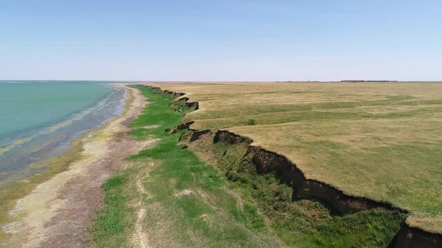 Flight over the coastline on a sunny summer day