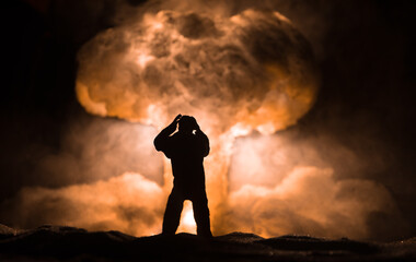 Nuclear war concept. Explosion of nuclear bomb. Creative artwork decoration in dark.