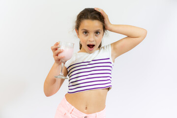 Smiling little kid hold smoothie bottle isolated over white background. Healthy concept.