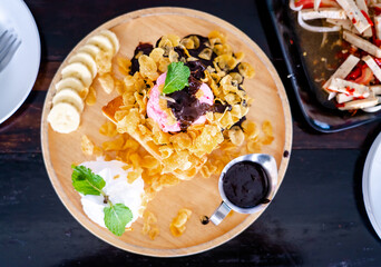 toast bread and toppings on black wooden table, top view