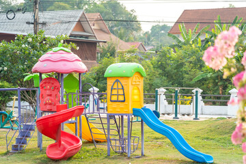 Colorful playground on yard in the park for kids.