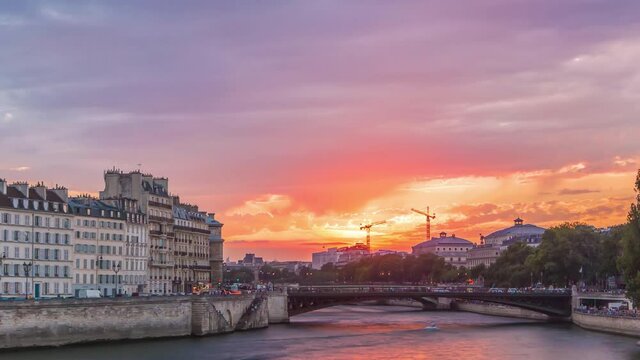 Le Pont D'Arcole bridge at sunset with people and boats timelapse, Paris, France, Europe