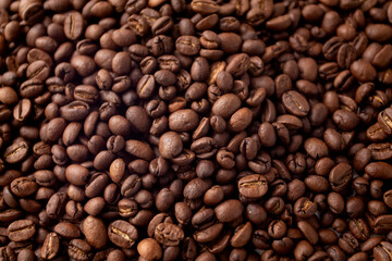Texture of coffee beans. Coffee beans background. Roasted coffee full frame