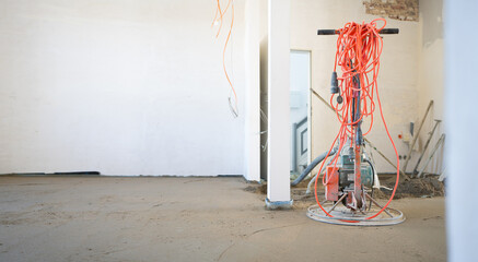 Filling the floor of a renovated apartment with concrete, screed and leveling the floor by...