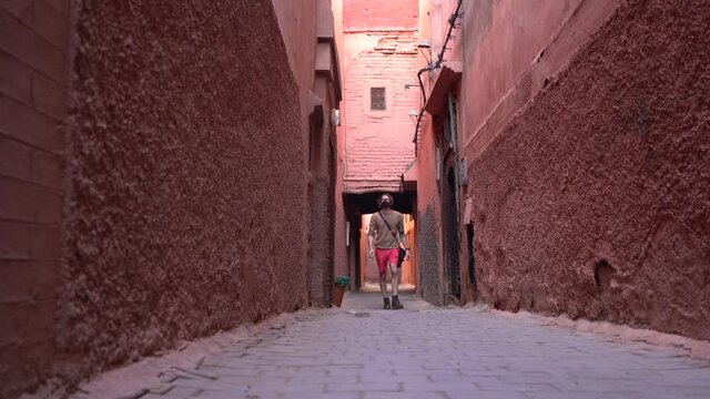 A man wears a face mask and walks in Marrakech during the pandemic