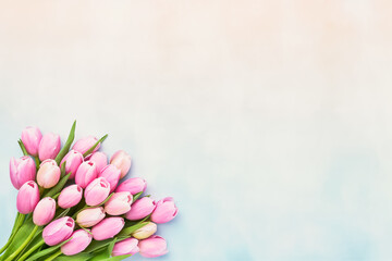 Bouquet of pink tulip flowers on a pastel background, selective focus. Mothers Day, bachelorette, birthday celebration concept
