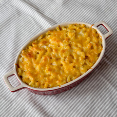 Homemade Macaroni and Cheese Pasta on cloth, low angle view.