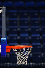 Basketball hoop on the background of the empty seats of the sports arena © makedonski2015