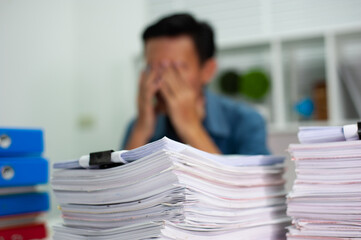 A men have stress and headaches from overwork.