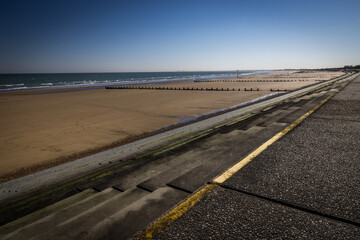 Steps to a deserted beach at Dymchurch, Kent, England