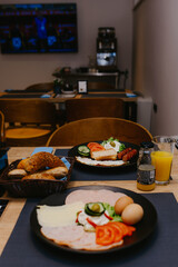 The healthy delicious breakfast served on the table in the cafe. Top view of healthy delicious breakfast served on the table in the cafe.