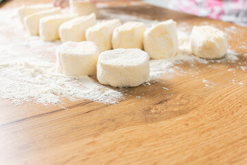 Woman preparing dough. Raw dough