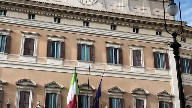 Facade of the Montecitorio Palace in Rome, seat of the Italian Chamber of Deputies in a sunny day.