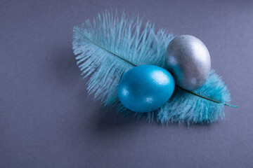 Banner. Silver and blue
easter eggs on a gray background. Minimal concept.