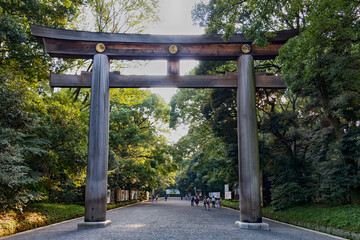 Entrance at Meiji Jingu Shrine in Tokyo. Wooden torii gate. Tokyo, Japan.
