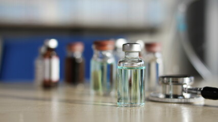 Vaccine bottle placed on table, Anti-virus vaccine bottle, copy space.