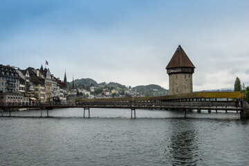 Landscape view of the Kappelbrücke (chapel bridge) of Luzern, with the Reuss river in the...