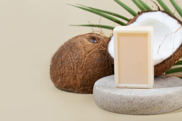 coconut soap on a podium, coconut, green leaf,  beige background, space for text