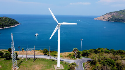Wind turbine in the tropics on the shore of the island