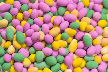 Group of colorful peanuts in glaze.