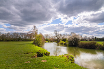 Walking the Ouse way in spring on a sunny afternoon, Barcombe Mills, England - obrazy, fototapety, plakaty