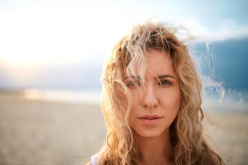 BEAUTIFUL NATURAL GIRL BY THE SEA, BOKEH PORTRAIT, SUNSET ON THE BEACH