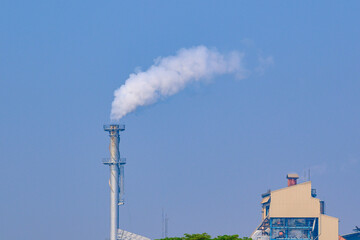 Smoke from factory chimneys. Emissions of air pollution and cause global warming.