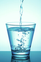 Pour water into the glass