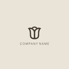 A symbol or logo of a simple, minimalistic, stylized tulip or flower bud shape, consisting of one element. Made with a thick line.