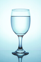 Water in a wine glass through a blue filter.