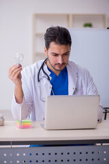 Young male doctor cardiologist in the classroom