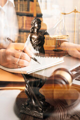justice and law concept.Male judge in a courtroom on wooden table and Counselor or Male lawyer working in office. Legal law, advice and justice concept.
