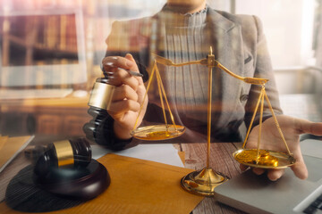 justice and law concept.Male judge in a courtroom on wooden table and Counselor or Male lawyer...