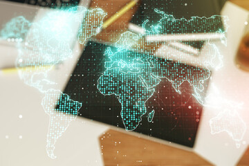 Double exposure of abstract digital world map and digital tablet on background, top view, research and strategy concept
