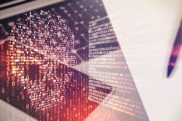 Creative code skull hologram on modern computer background, cybercrime and hacking concept. Multiexposure