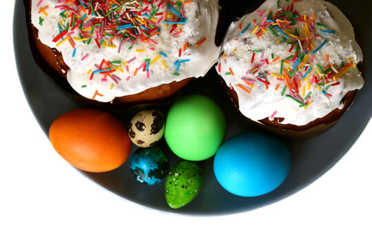 Easter cakes (Orthodox Easter cakes), eggs. The scene of the Easter holiday. Festive composition on a white table. copy space