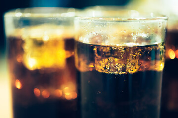 Refreshing Bubbly Soda Pop with Ice Cubes. Cold soda iced drink in a glasses - Selective focus, shallow DOF