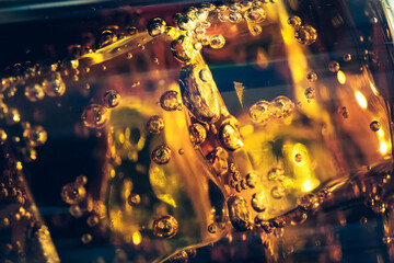 Refreshing Bubbly Soda Pop with Ice Cubes. Cold soda iced drink in a glasses - Selective focus, shallow DOF
