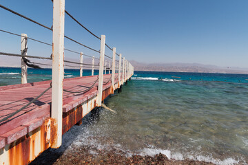 wooden bridge over the sea