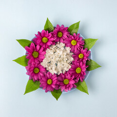 Beautiful round spring flower arrangement on a blue background