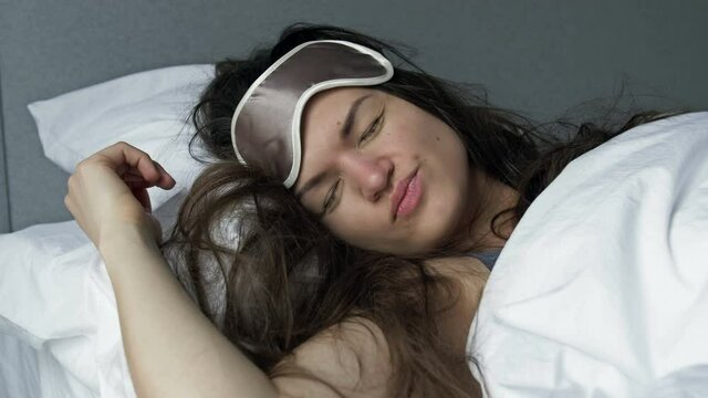 Young woman sleeps ugly after drinking alcohol. Hangover Syndrome.