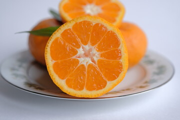 ripe and juicy tangerine (mandarin). cutaway tangerine fruit on a white background.