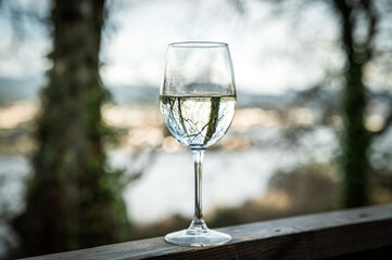 Glass of wine on wooden terrace