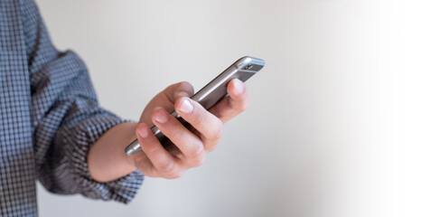 man using smartphone to searching on internet or looking  at social media application for  lifestyle and technology or business concept