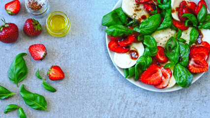 Delicious summer salad with strawberries and mozzarella. Strawberry caprese salad.