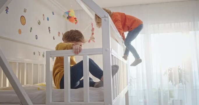 Brothers playing on bunk bed at home